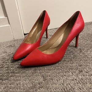 Red pointed toe leather heels